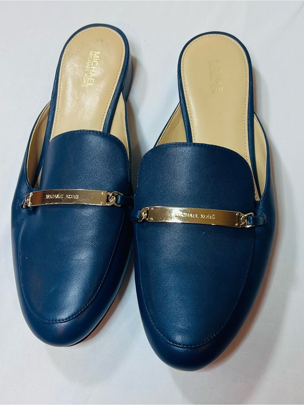 Michael Kors Navy Leather Backless Loafers with Gold Logo Bar